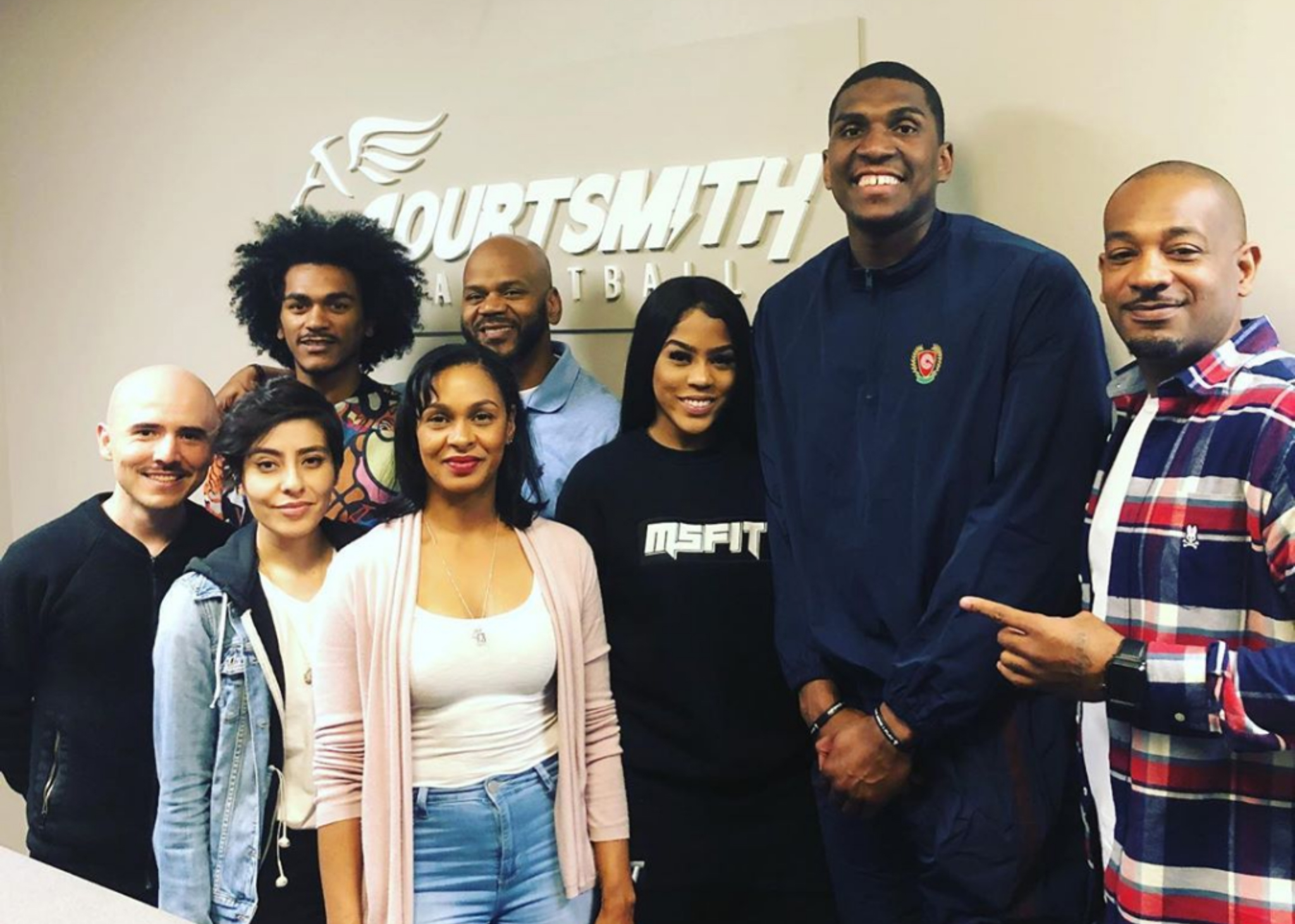 Courtney Smith (right) and his team with Warriors center Kevon Looney and Mariah Simone.